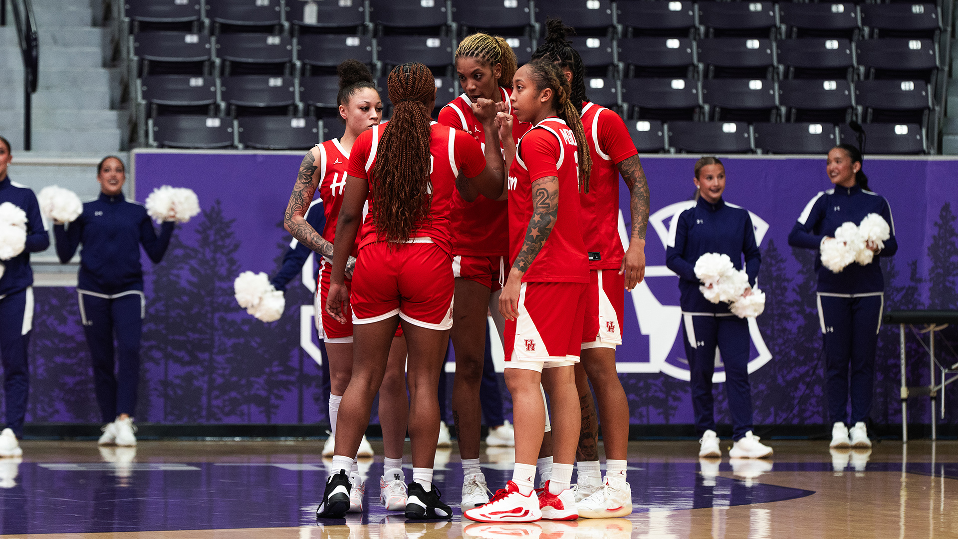 Houston women's basketball huddles